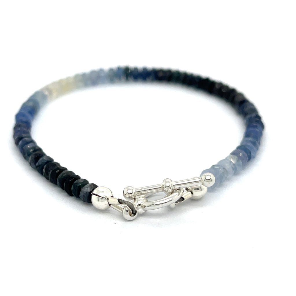 Genuine Sapphire gemstone bracelet with sterling silver toggle clasp by Hidden Jewel on a white background toggle overview. 