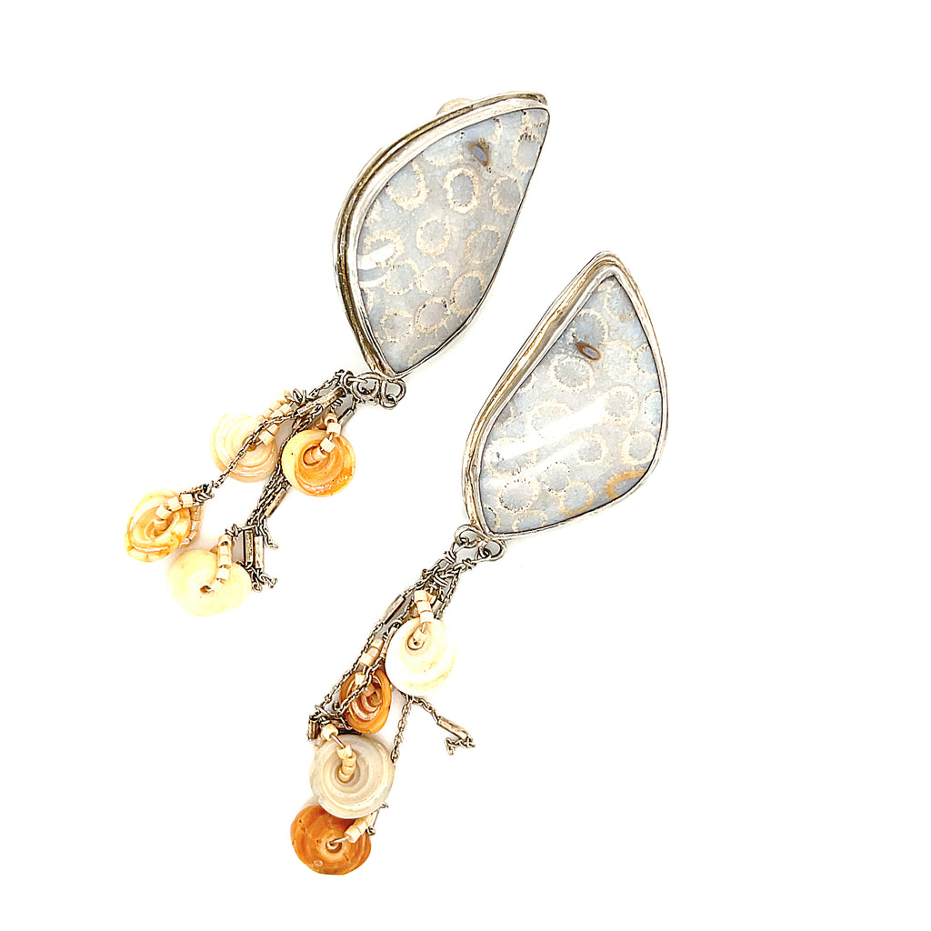 Genuine fossil coral earrings in sterling silver with flower-like patterns on a white background center front overview. 