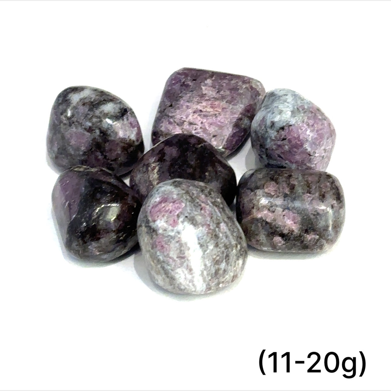 Group of Garnet with Astrophyllite tumbled gemstones on a white background sizes (11-20g) front overview