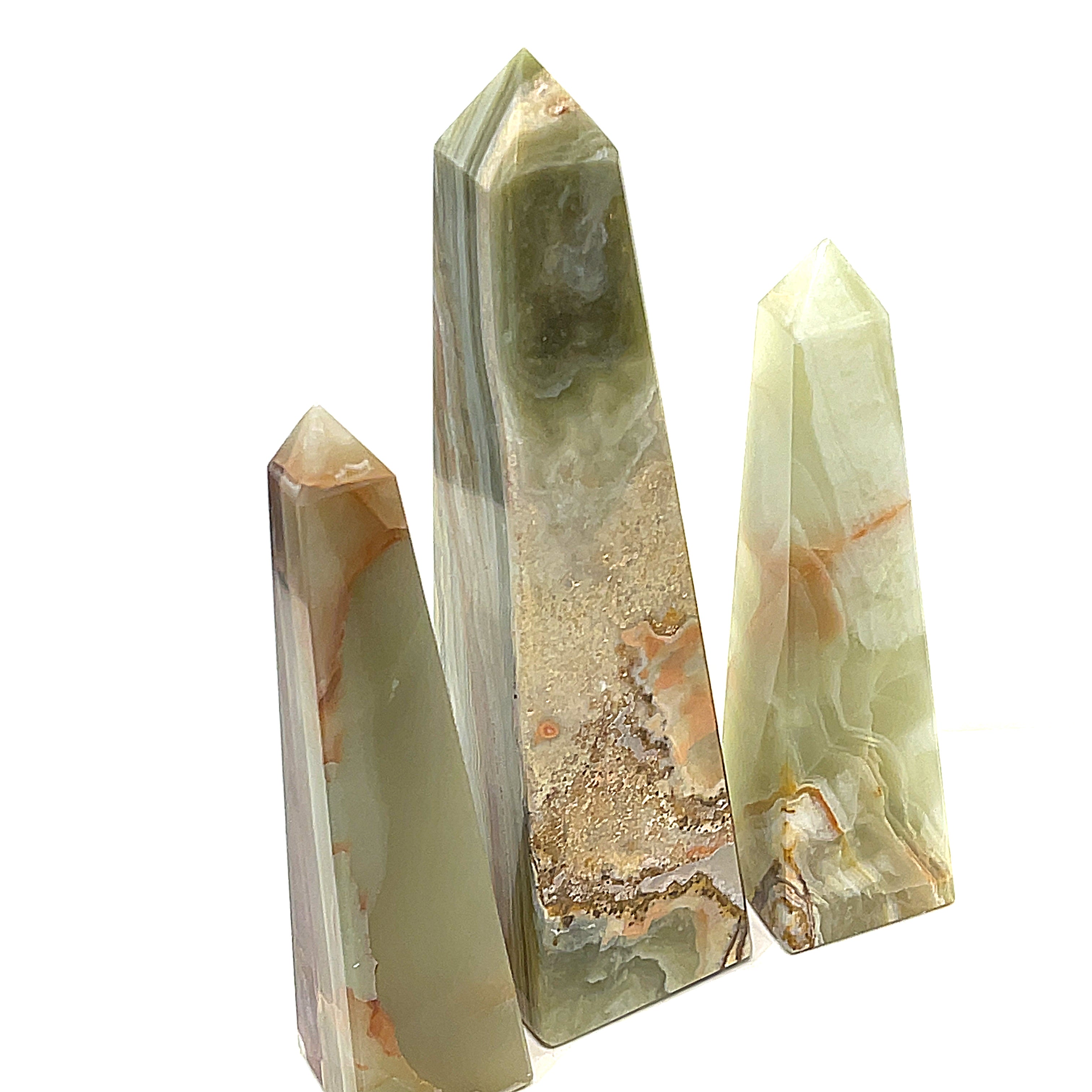 Group of ethically sourced Onyx towers from Hidden Jewel of the South End on a white background, front view.