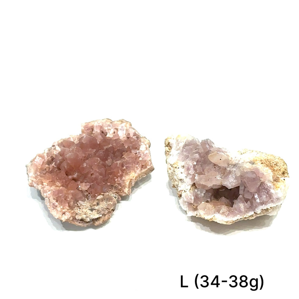 Group of pink amethyst clusters on white background showing natural variations on white # L front view