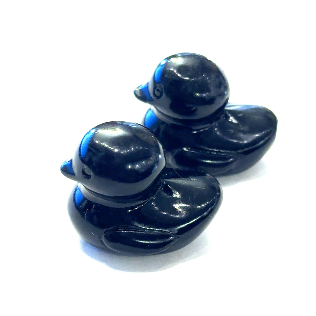 Hand-carved gemstone sculpture of a duck made from Black Obsidian, with a smooth finish on a white background front view
