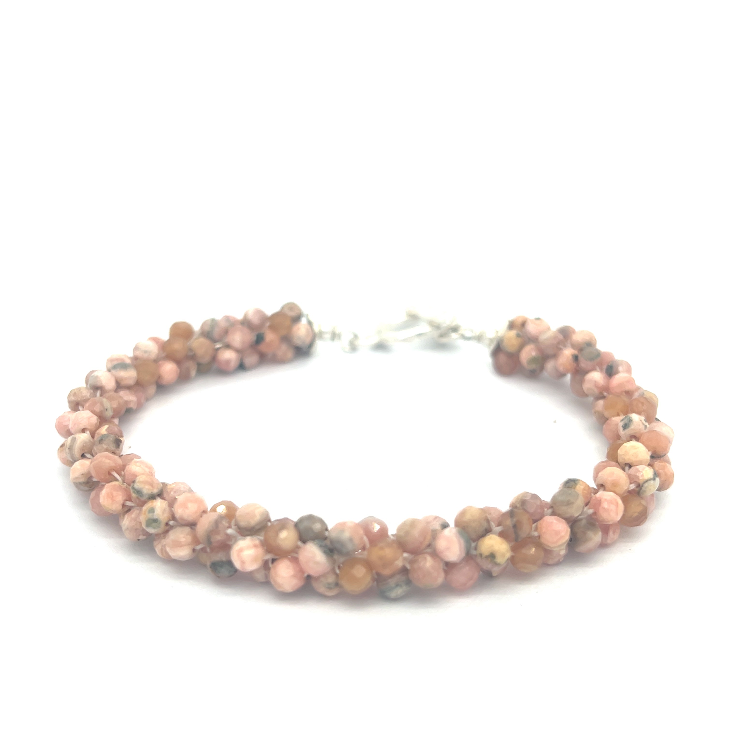 Hand-crocheted Rhodochrosite gemstone bracelet with sterling silver  toggle clasp on a white background front center overview.