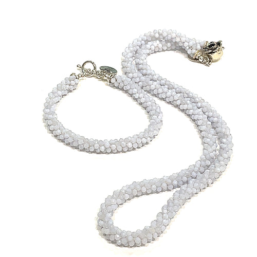 Handcrafted Blue Chalcedony gemstone bracelet with its matching necklace on a white background front overview. 