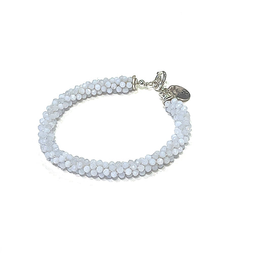 Handcrafted Blue Chalcedony gemstone bracelet with sterling silver toggle on a white background front overview. 