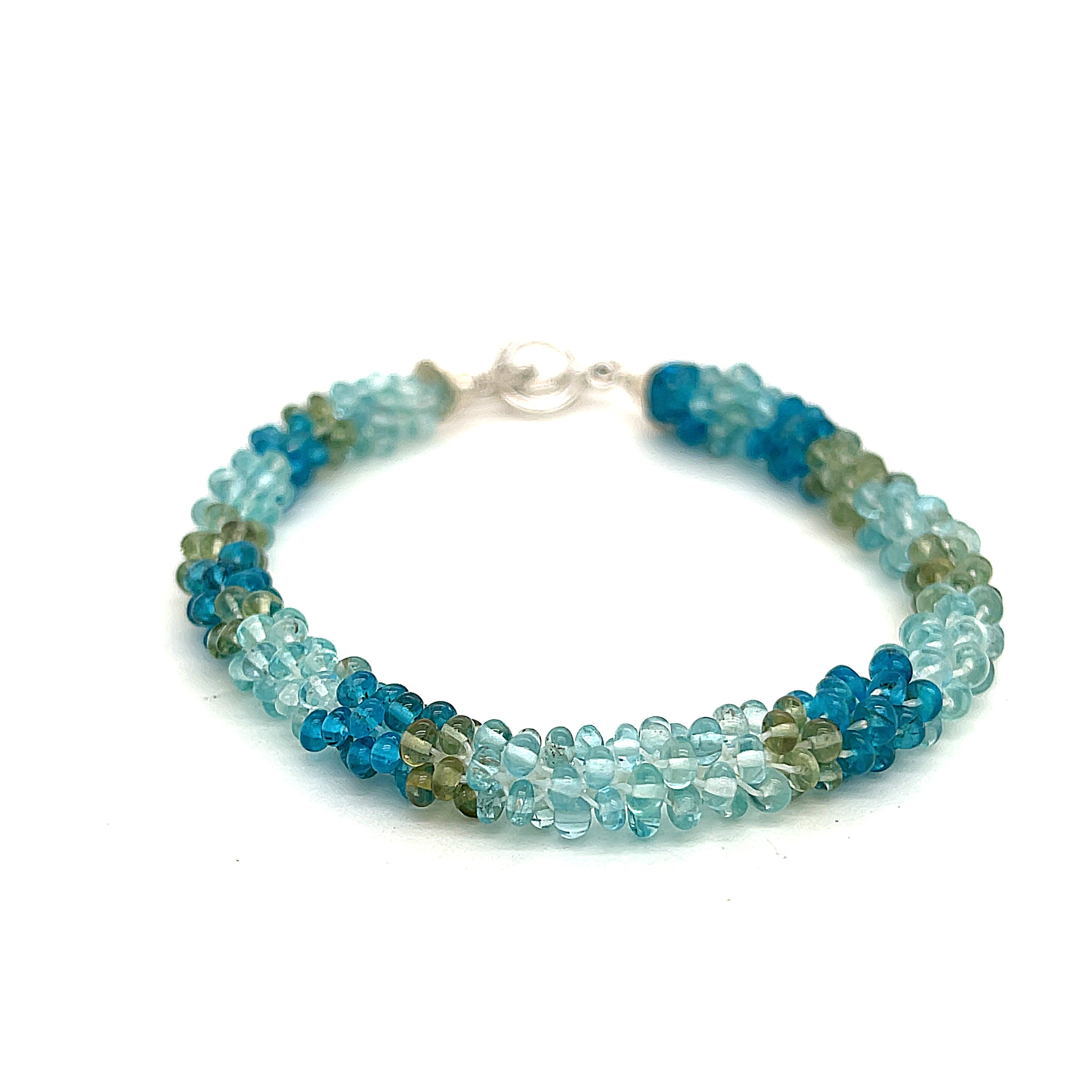 Handcrafted Fluorite gemstone bracelet with sterling silver toggle on a white background, front overview. 