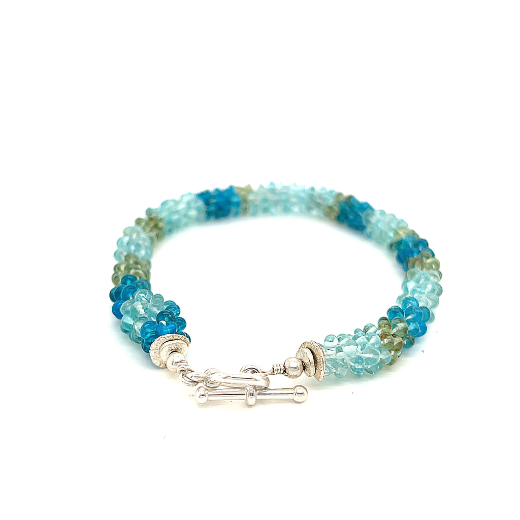Handcrafted Fluorite gemstone bracelet with sterling silver toggle on a white background, toggle overview. 