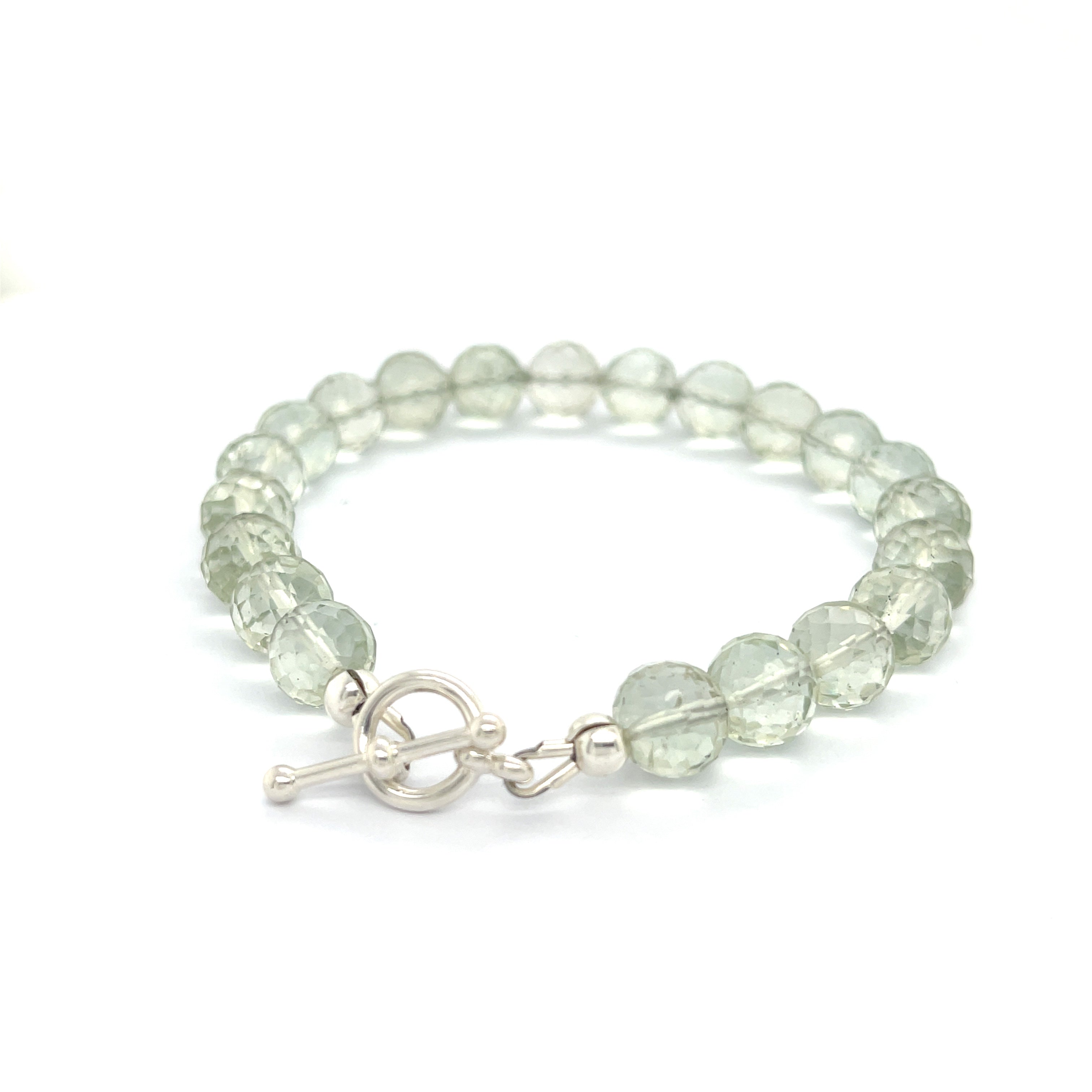 Handcrafted Prasiolite (Green Amethyst) gemstone bracelet with sterling silver toggle clasp by Hidden Jewel Boston on a white background back left angle overview. 