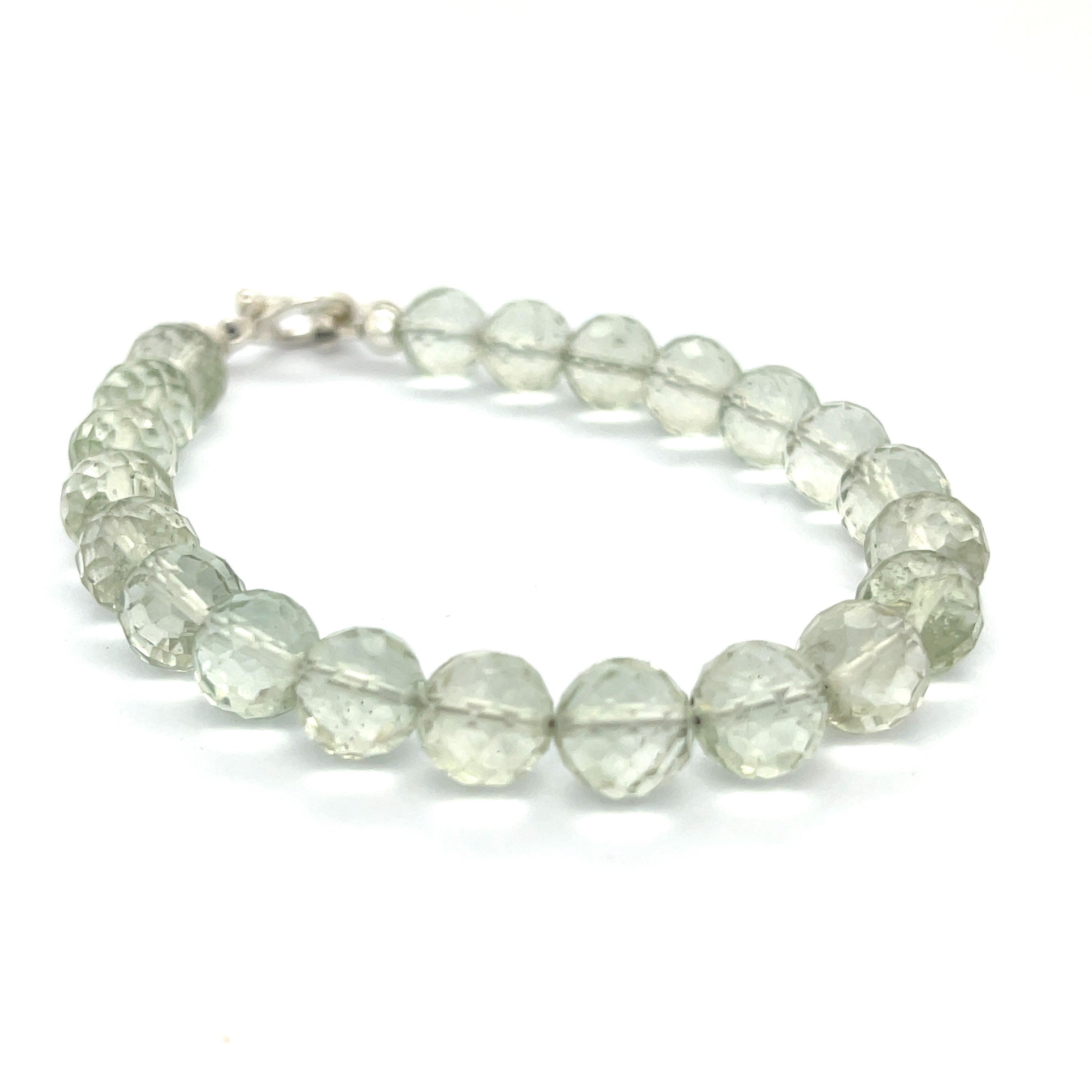 Handcrafted Prasiolite (Green Amethyst) gemstone bracelet with sterling silver toggle clasp by Hidden Jewel Boston on a white background front right angle overview. 