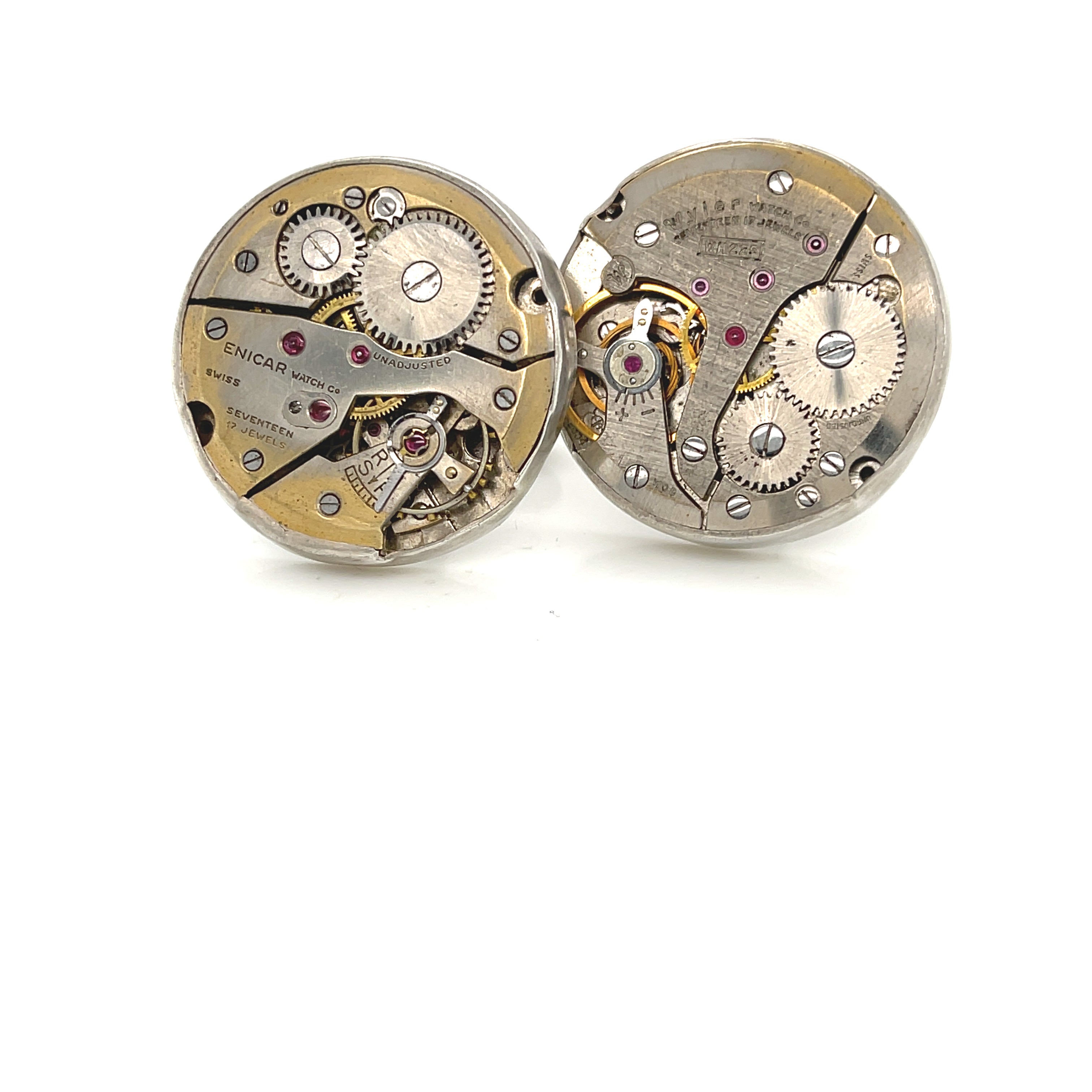 Handcrafted antique watch movement cuff links in sterling silver on a white background front  overview. 