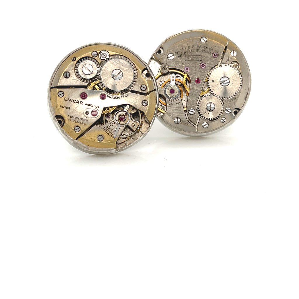 Handcrafted antique watch movement cuff links in sterling silver on a white background front  slight angle view. 