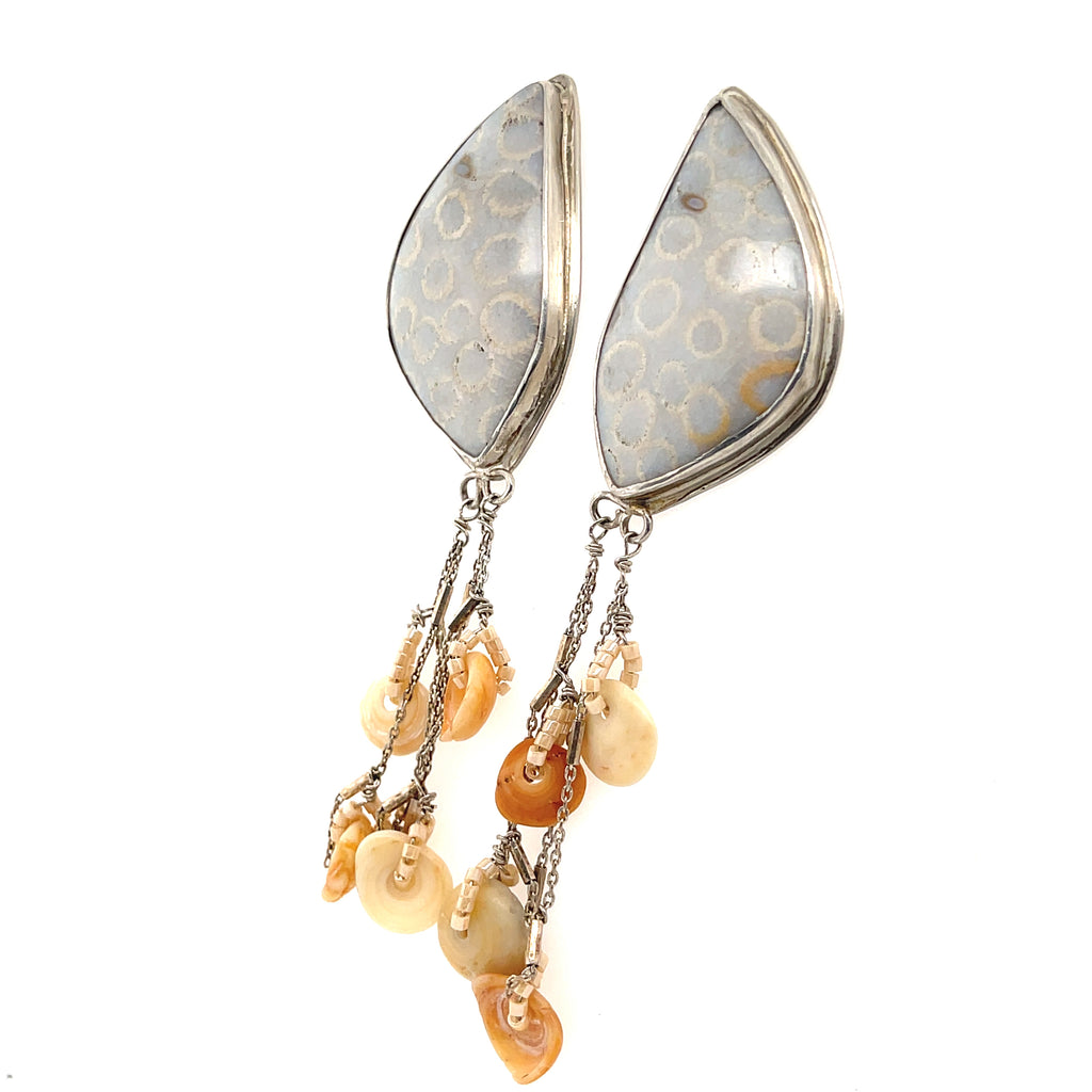 Handcrafted fossil coral gemstone studs by Hidden Jewel Boston on a white background center front hanging angle overview. 