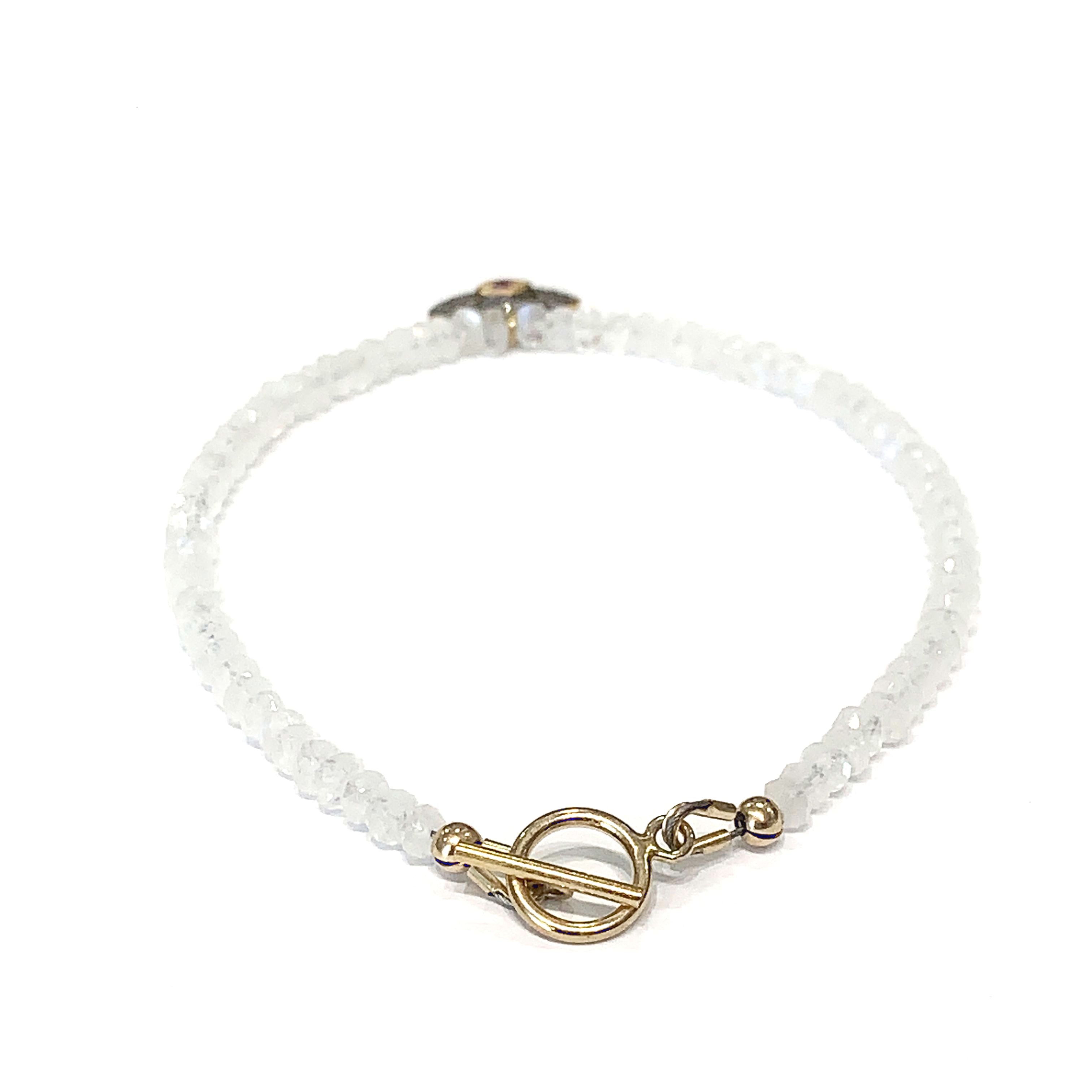Rainbow Moonstone with a gold filled paved diamond evil eye charm beaded bracelet