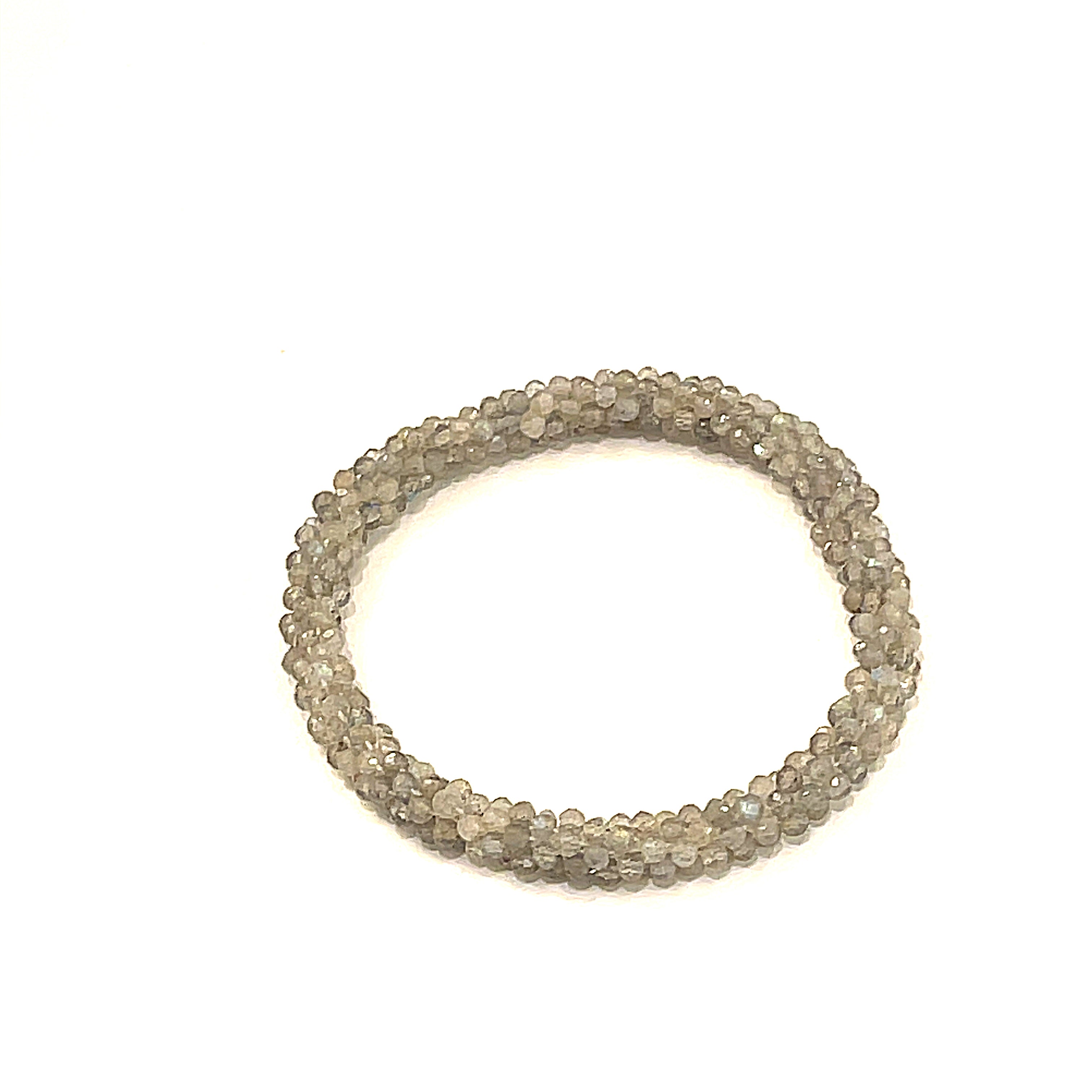 Labradorite roll-on bracelet with shimmering blue flashes front overview. 