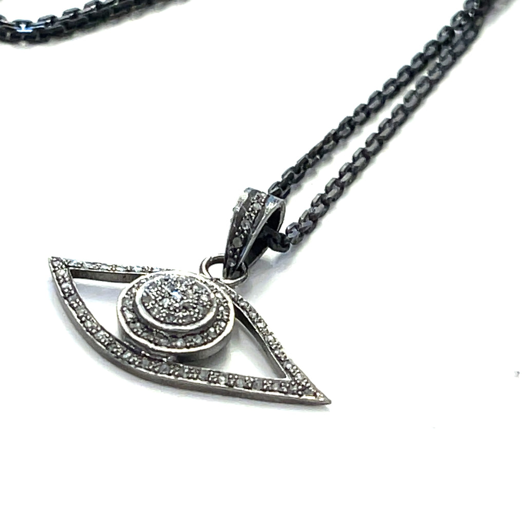 Oxidized sterling silver Evil Eye pendant necklace with pavé diamonds by Hidden Jewel on a white background pendant view.