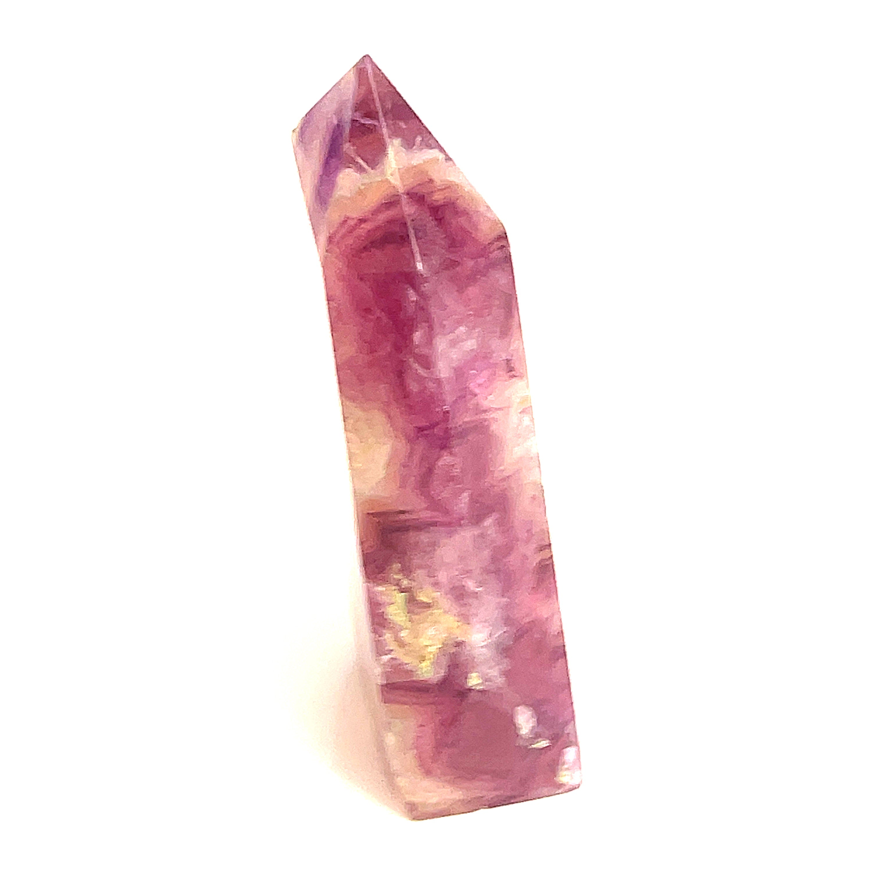 Rainbow Fluorite slab tower with magenta banding under light on a white background, front view. 
