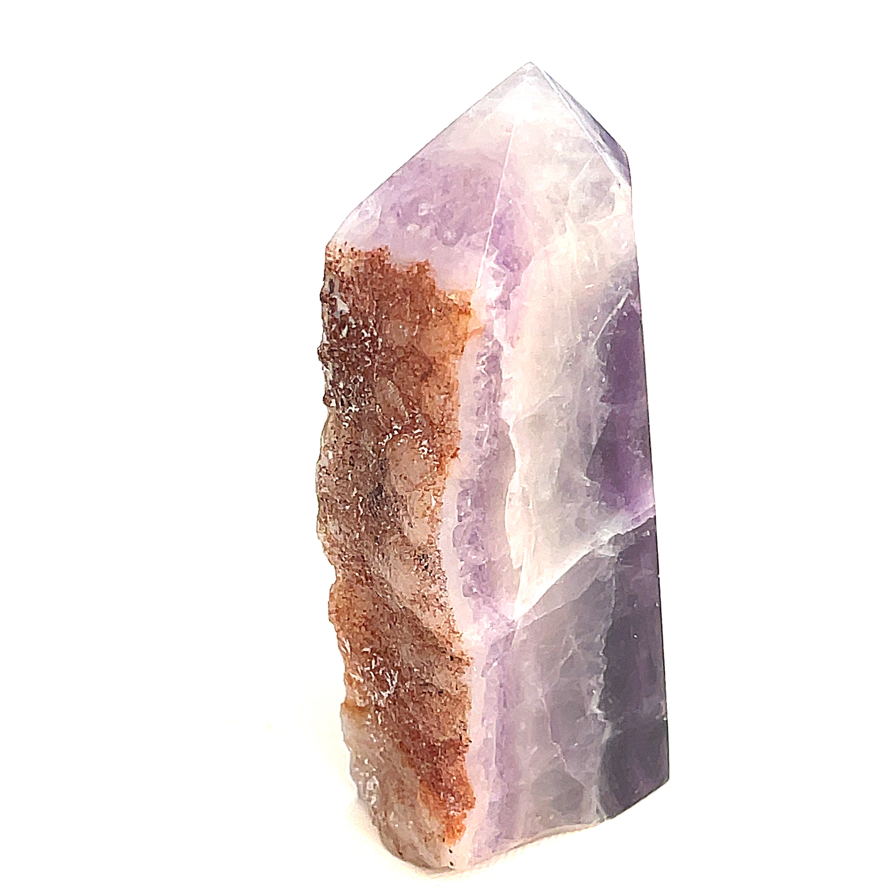 Rainbow Fluorite slab tower with purple banding under light on a white background, front view. 