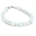Rainbow Moonstone beaded bracelet with a sterling silver toggle on a white background front overview. 