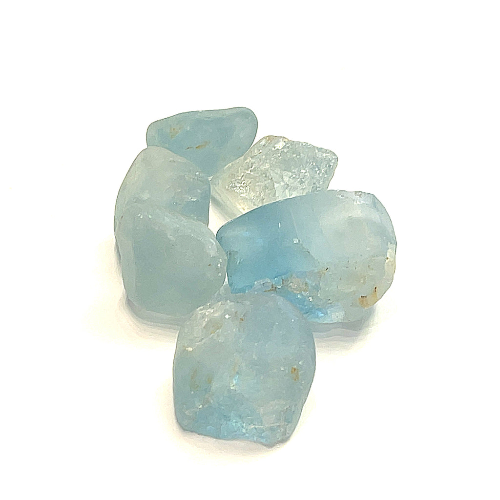 Raw Blue Topaz Gemstone on white grouping extra large center  overview i