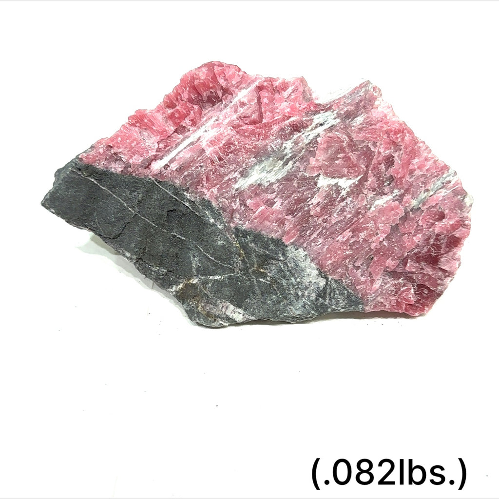 Raw Rhodonite gemstone in pink and black tones on white background size (.082lbs.) front view