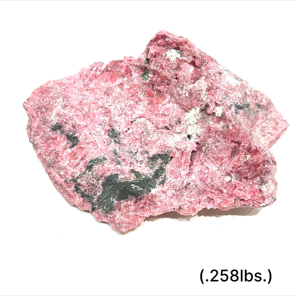Raw Rhodonite gemstone in pink and black tones on white background size (.258lbs.) front view