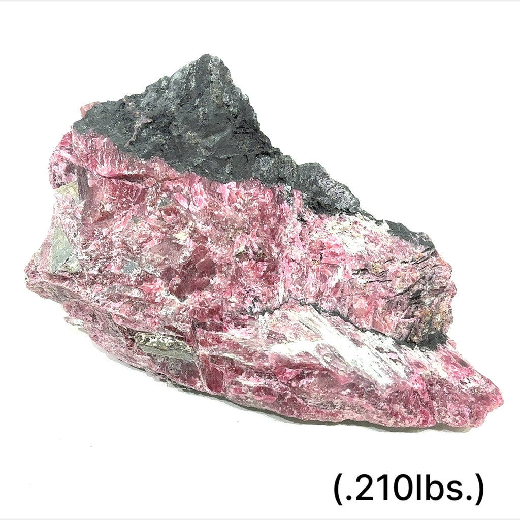 Raw Rhodonite gemstone in pink and black tones on white background size (.2l10bs.) front view