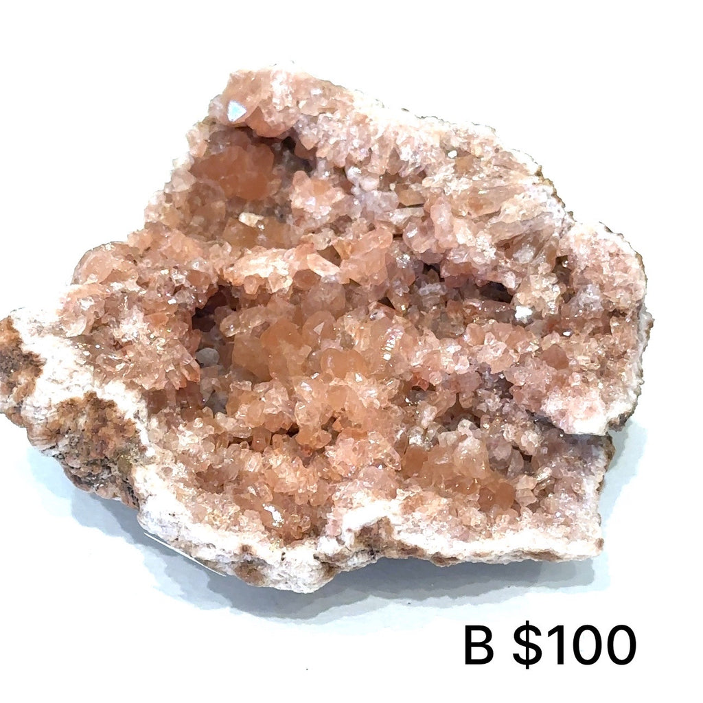 Raw pink amethyst cluster showing natural crystal points and soft pink hues on white #B  front view
