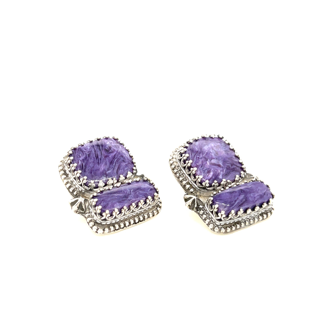 Rectangle Charoite double stone sterling silver earrings with swirling purple patterns studs an up-close front right angle view on a white background.