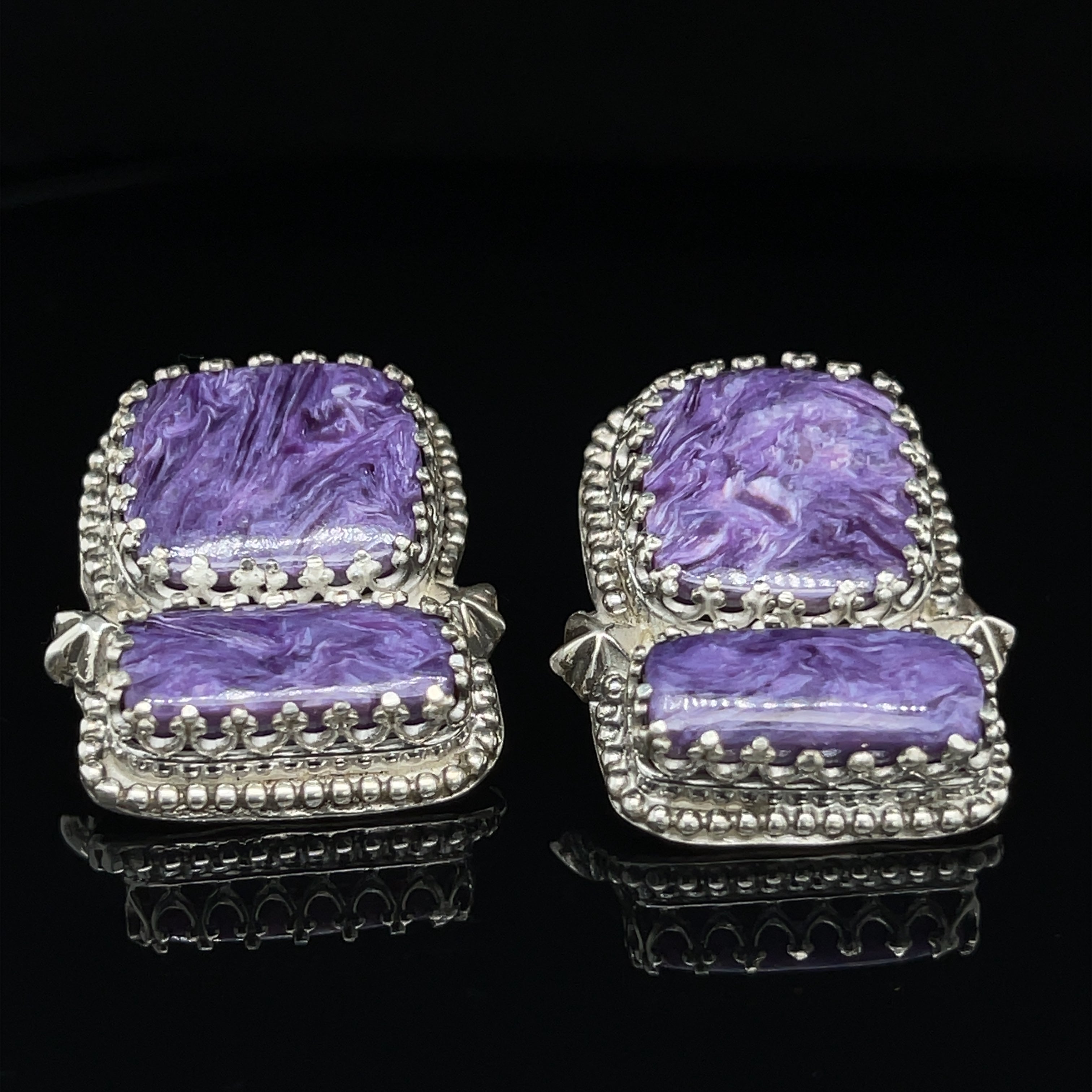 Rectangle Charoite double stone sterling silver earrings with swirling purple patterns studs an up-close front view on a black background.