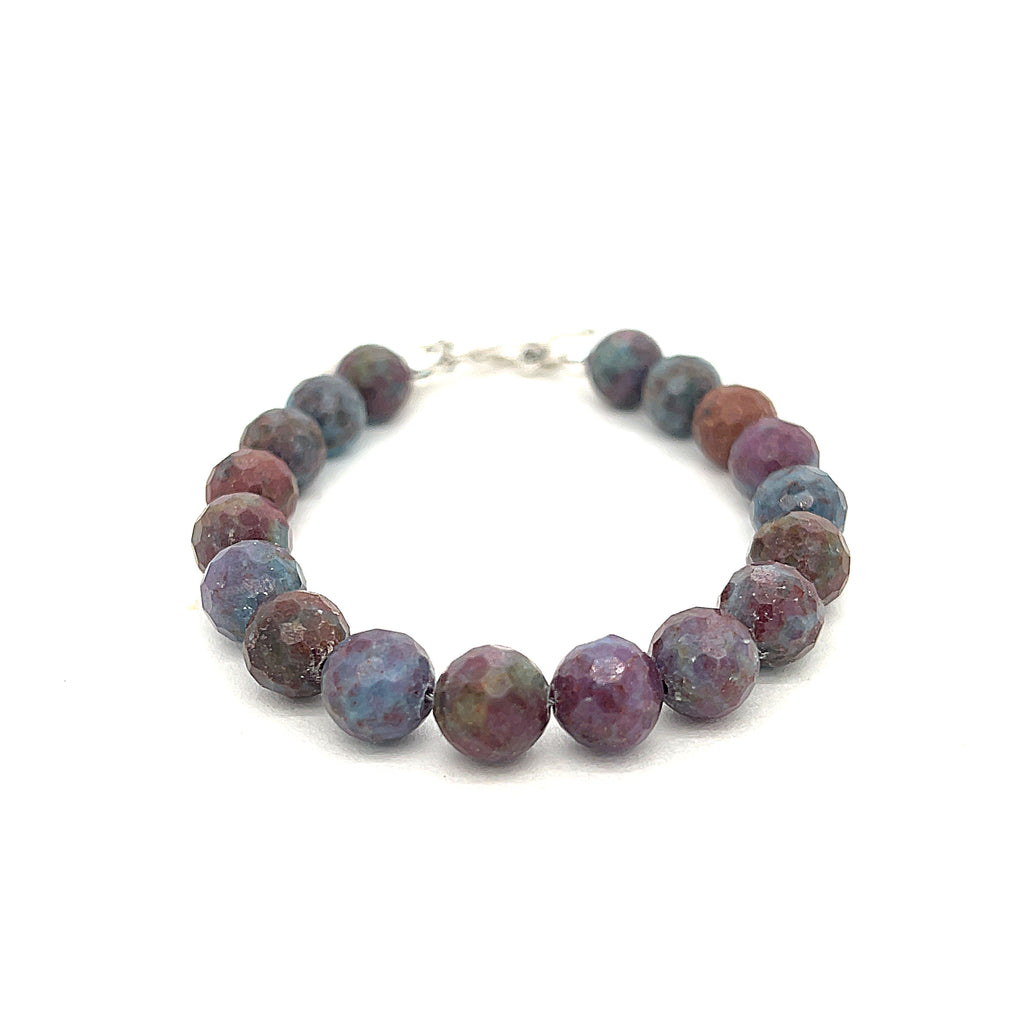 Ruby Kyanite gemstone bracelet with a sterling silver toggle clasp on a white background, front and center overview. 