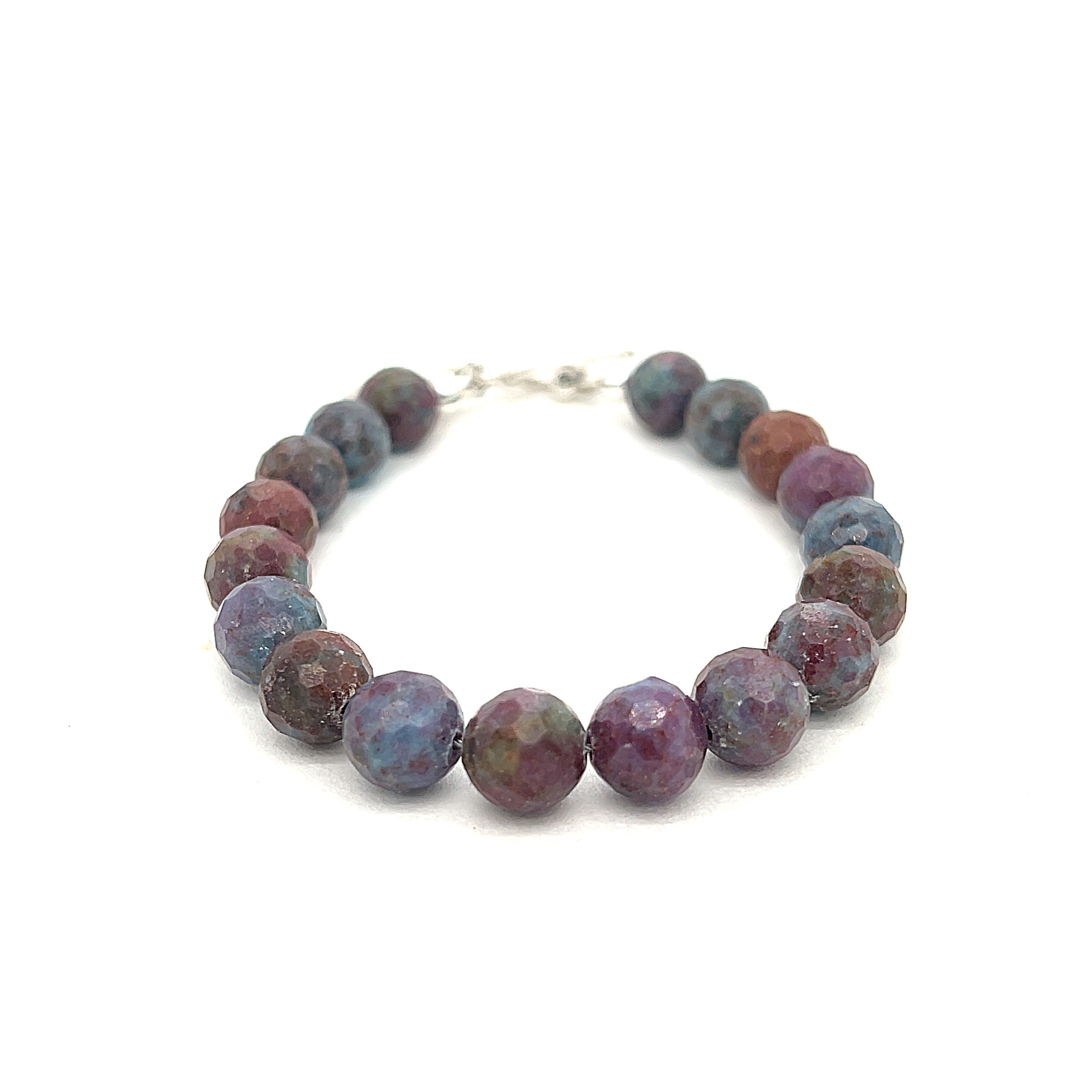 Ruby Kyanite gemstone bracelet with a sterling silver toggle clasp on a white background, front and center overview. 