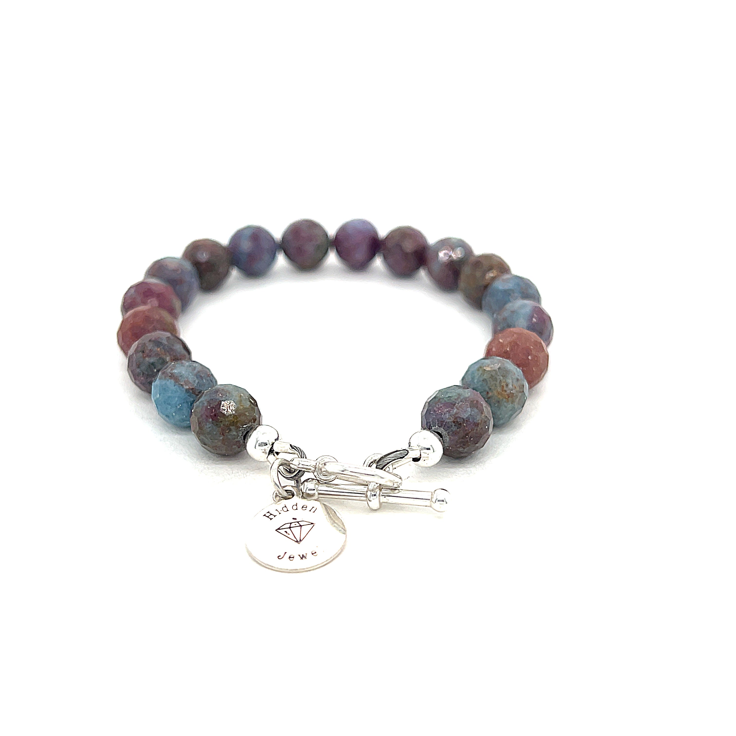Ruby Kyanite gemstone bracelet with sterling silver toggle clasp on white background back and center overview. 