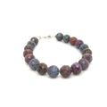 Ruby Kyanite gemstone bracelet with sterling silver toggle clasp on white background front and center overview. 