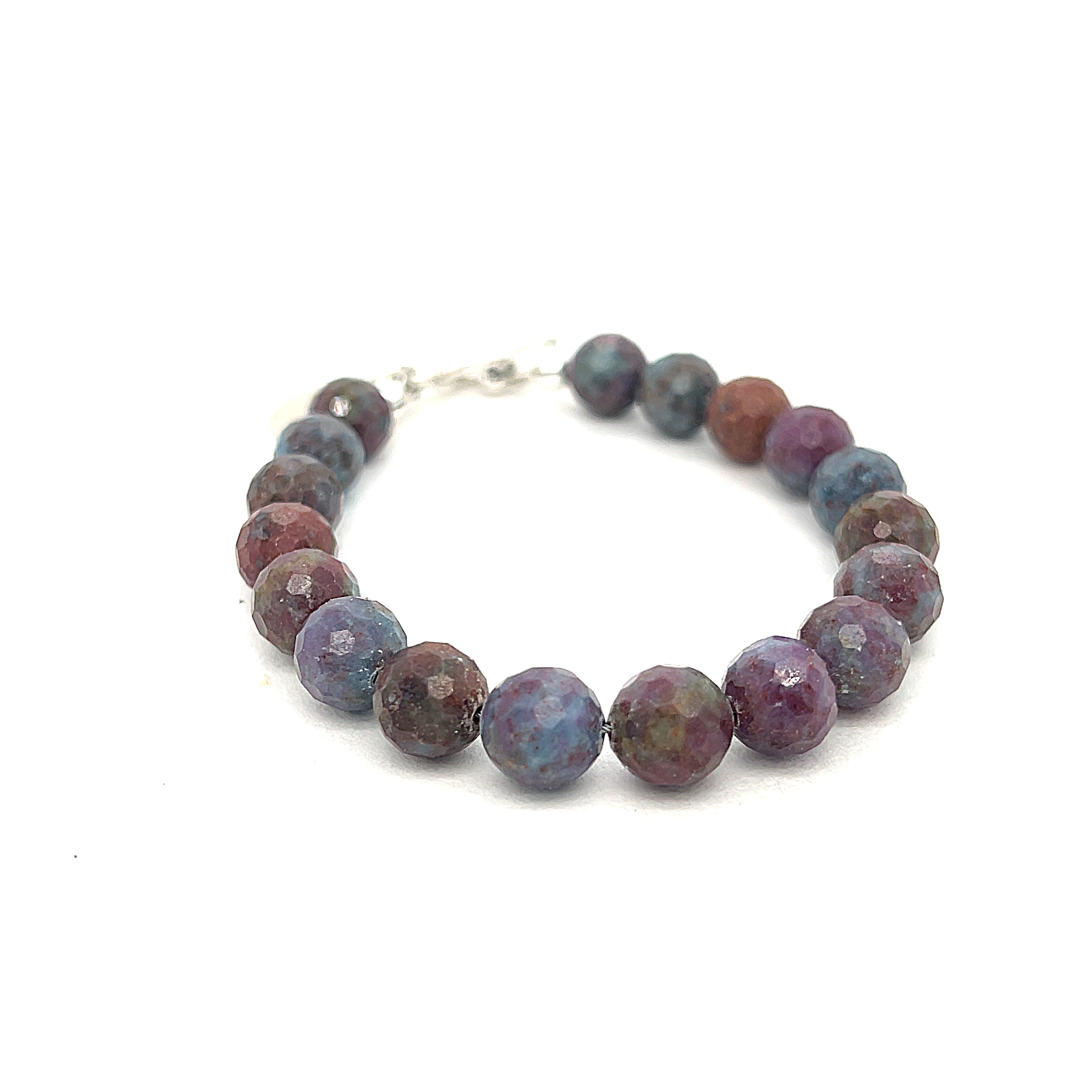 Ruby Kyanite gemstone bracelet with sterling silver toggle clasp on white background front and center overview. 