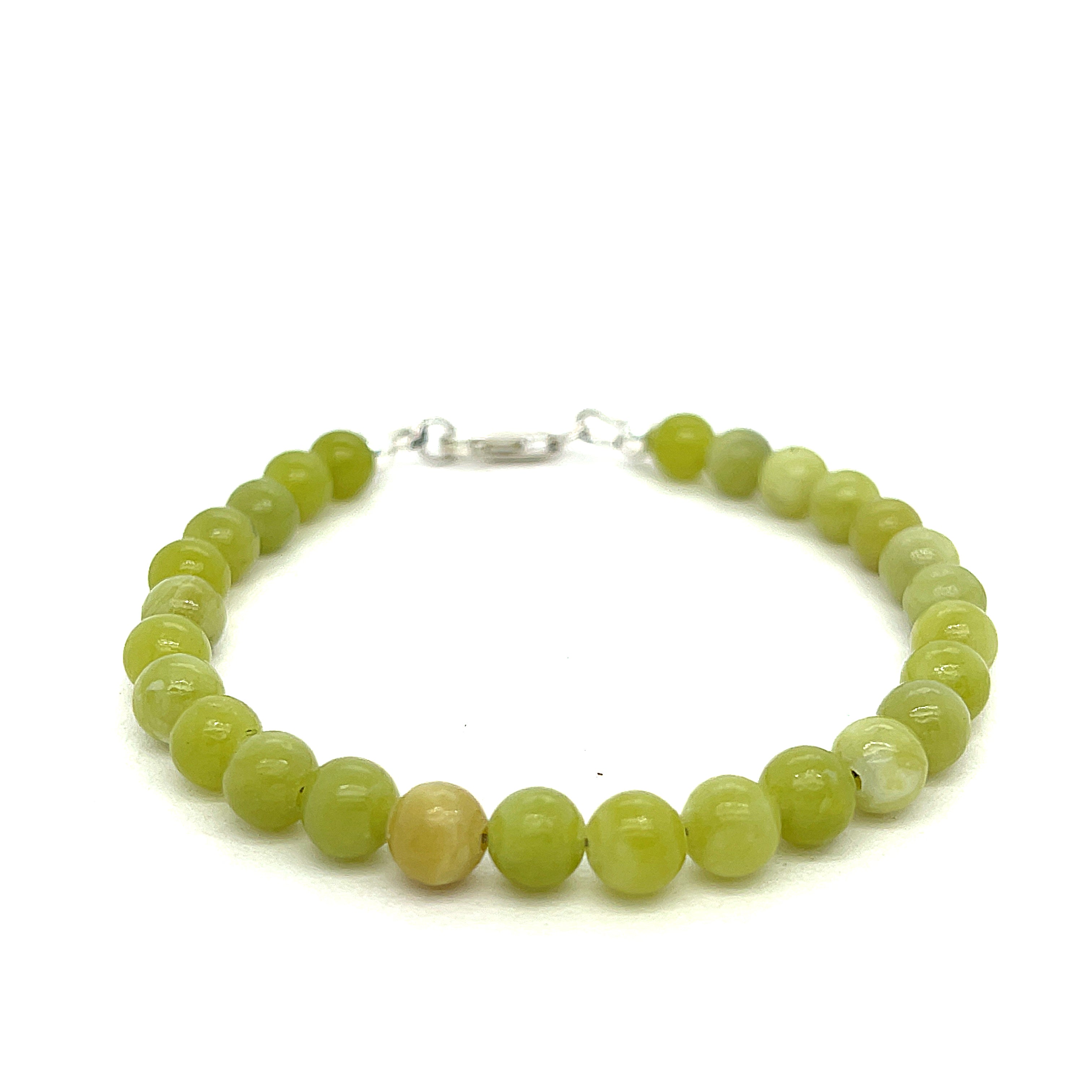 Serpentine gemstone bracelet with 6mm smooth green beads and Sterling Silver clasp from Hidden Jewel of the South End on a white background front overview. 