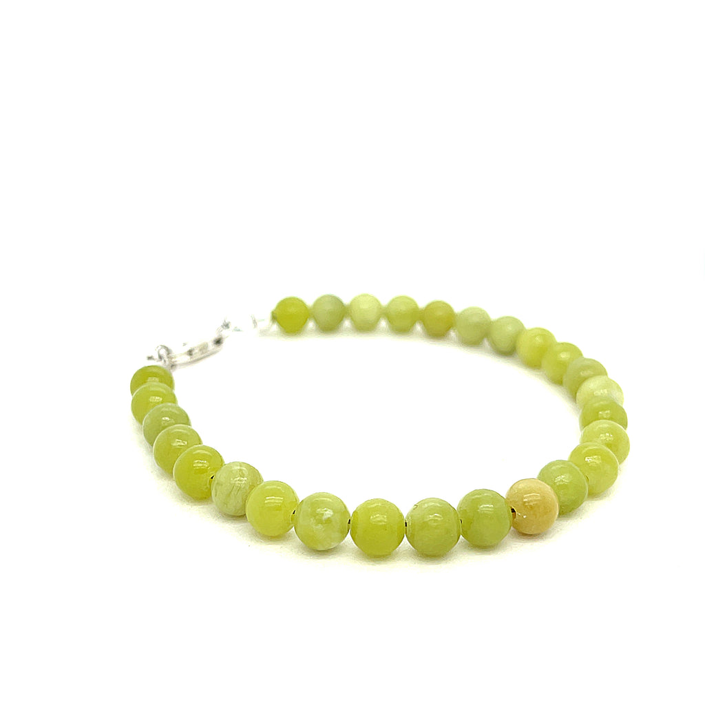 Serpentine gemstone bracelet with 6mm smooth green beads and Sterling Silver clasp from Hidden Jewel of the South End on a white background front view. 