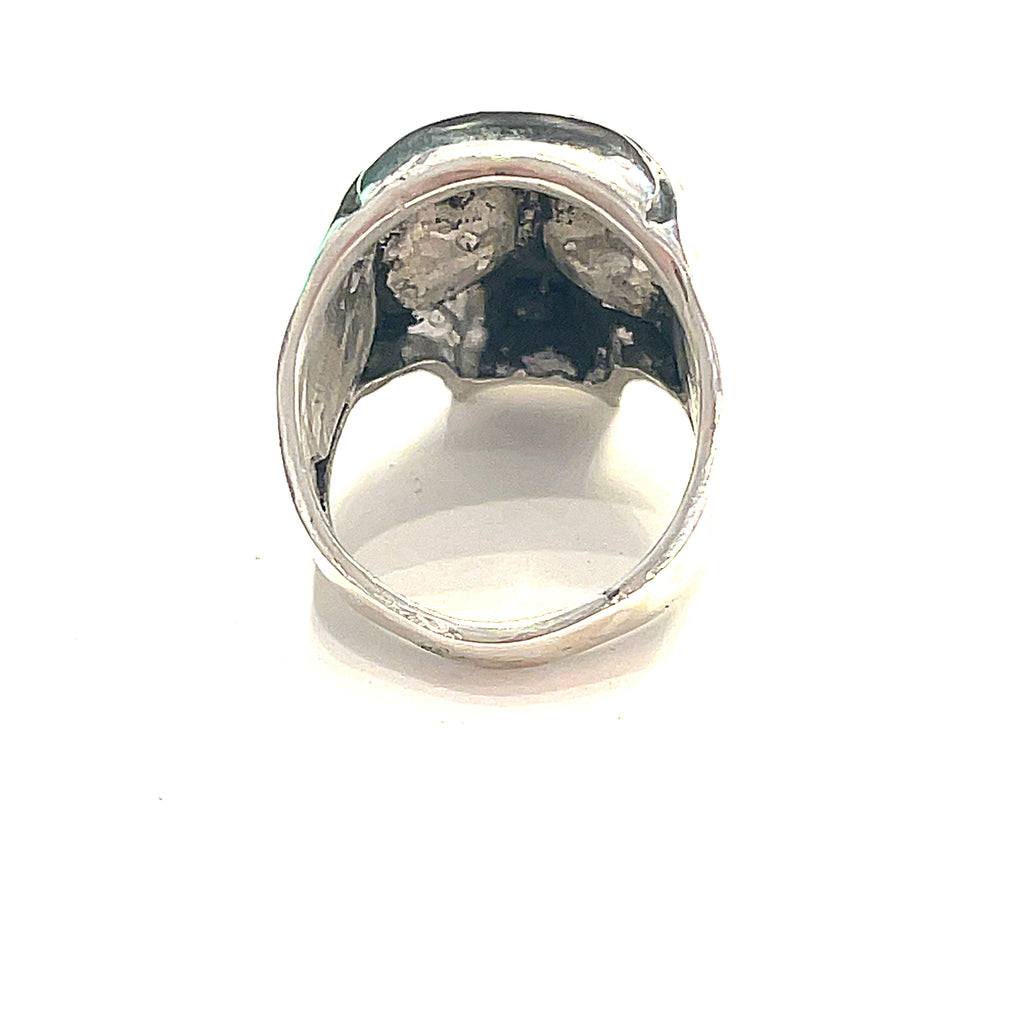 Smoky quartz gemstone skull ring — handcrafted statement piece  on a male models finer on a white background back view