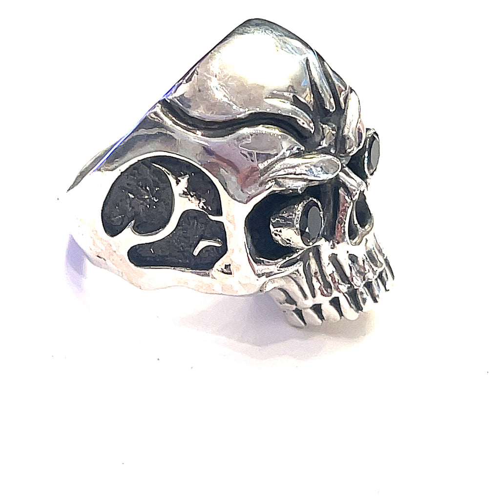 Smoky quartz gemstone skull ring — handcrafted statement piece  on a male models finer on a white background right side view