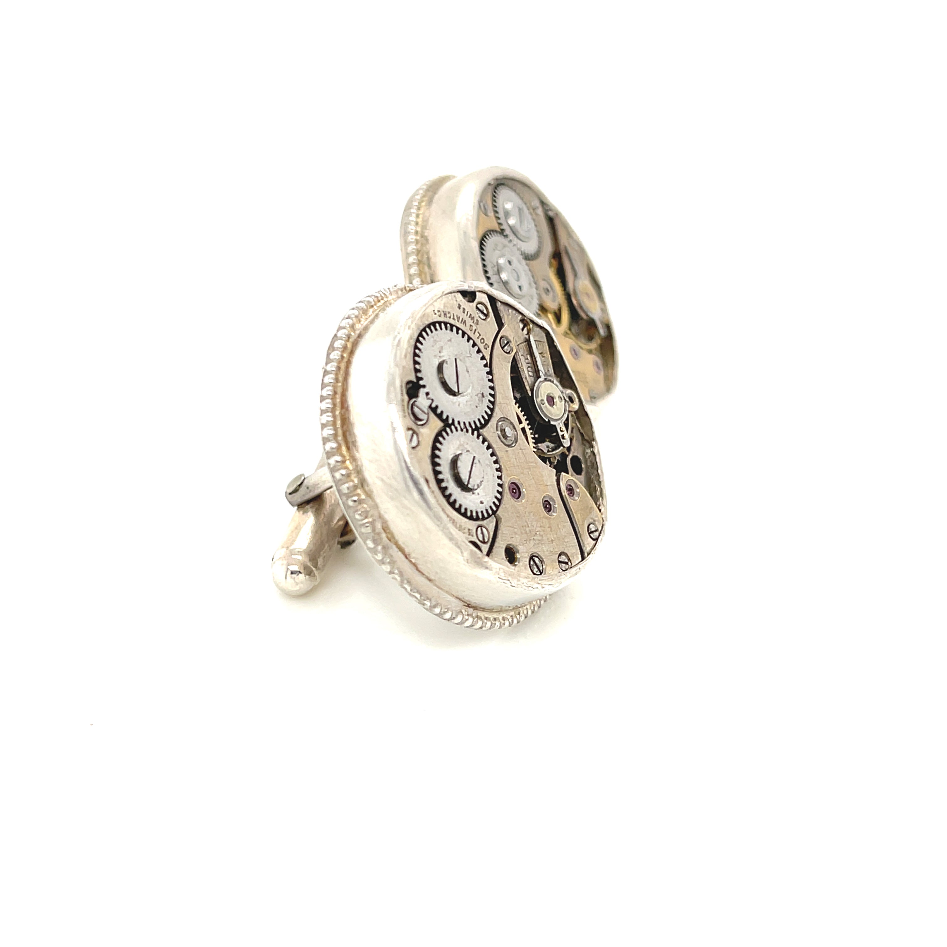 Sterling silver cuff links with mechanical detail handcrafted  in Boston on a white background  a  right side overview.