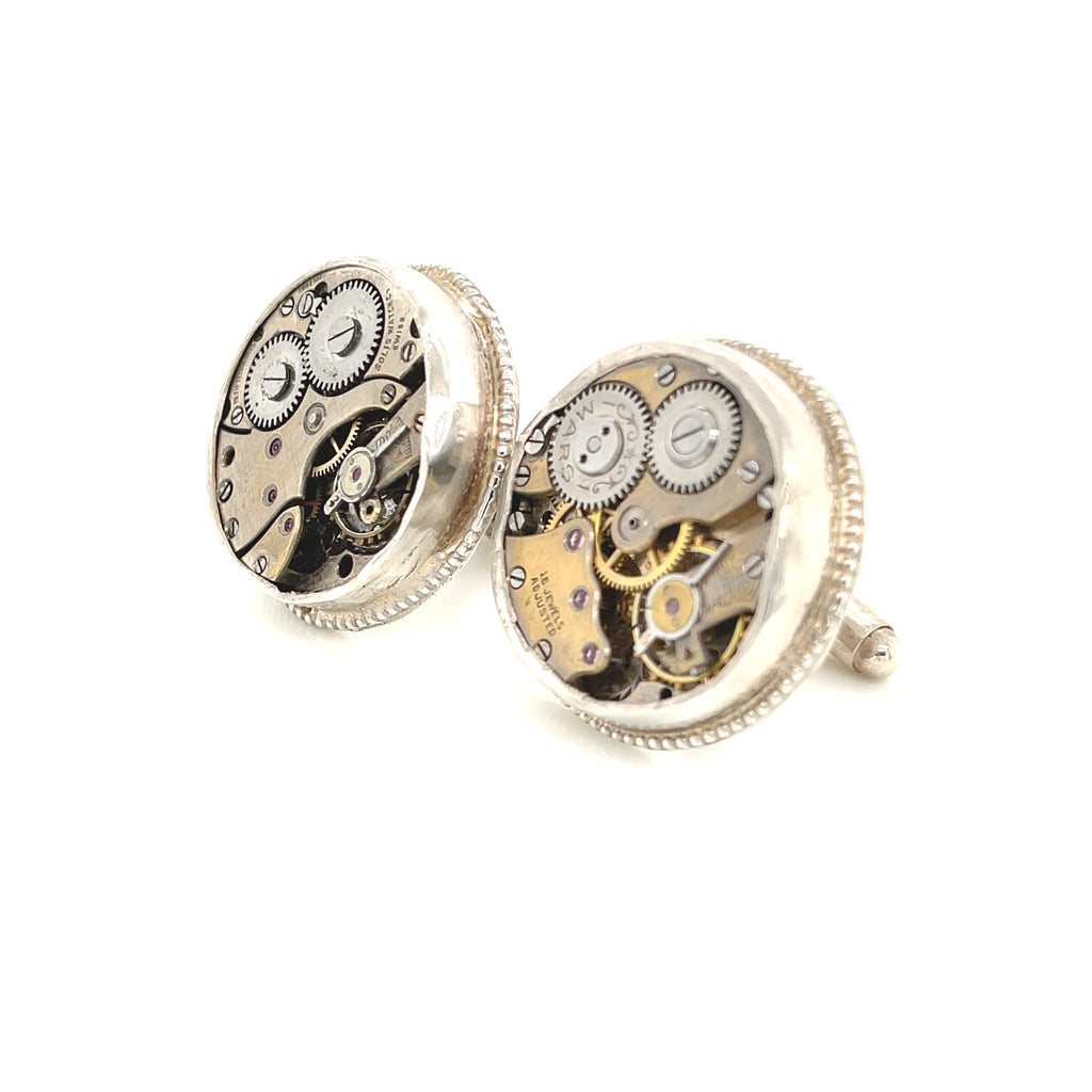 Sterling silver cuff links with mechanical detail handcrafted  in Boston on a white background left angle view. 