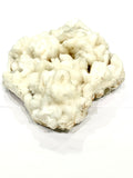 Stilbite (#1) zeolite crystal on a white background, front view.