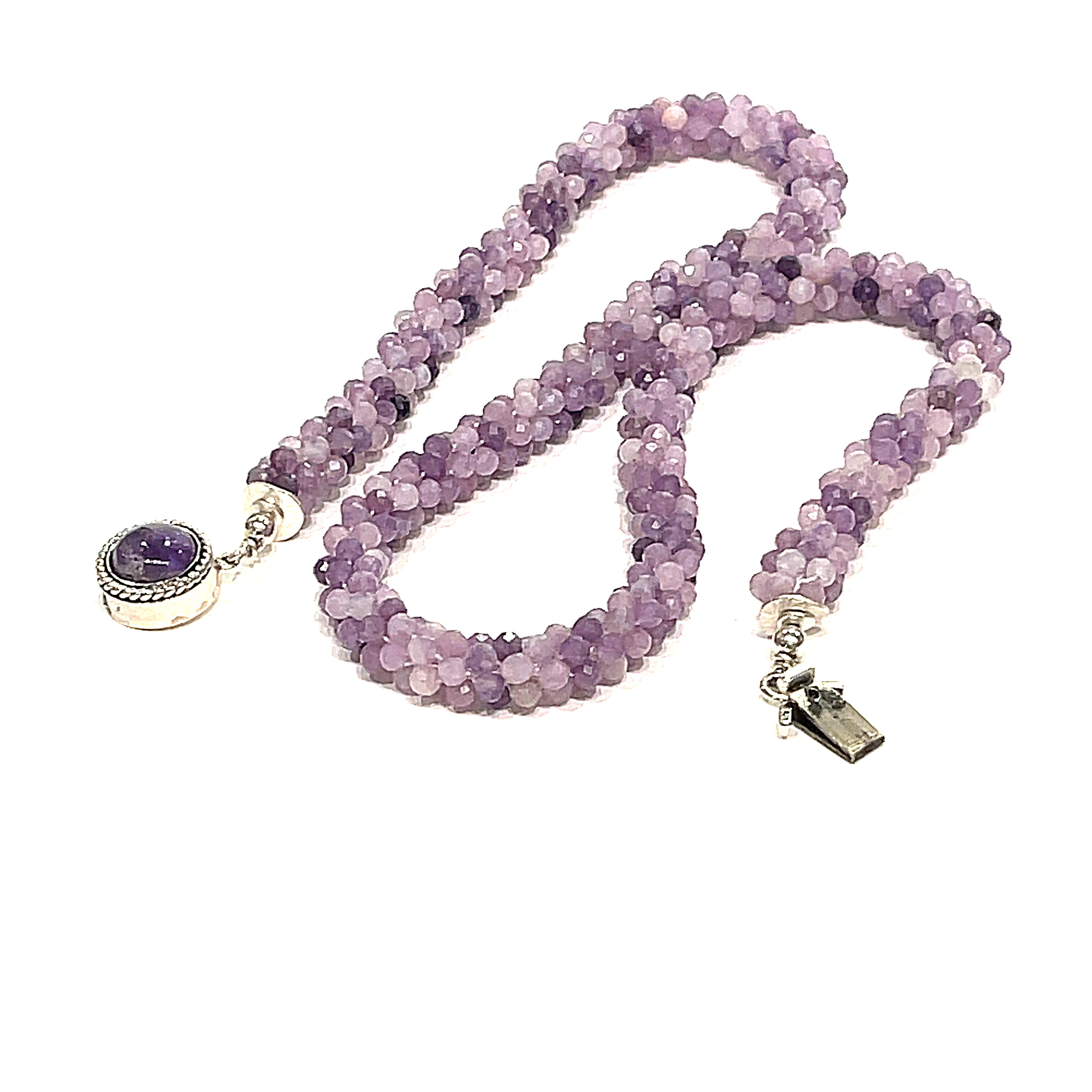 Sugilite crocheted gemstone necklace on a white background, zigzag lay out, front, close-up overview. 