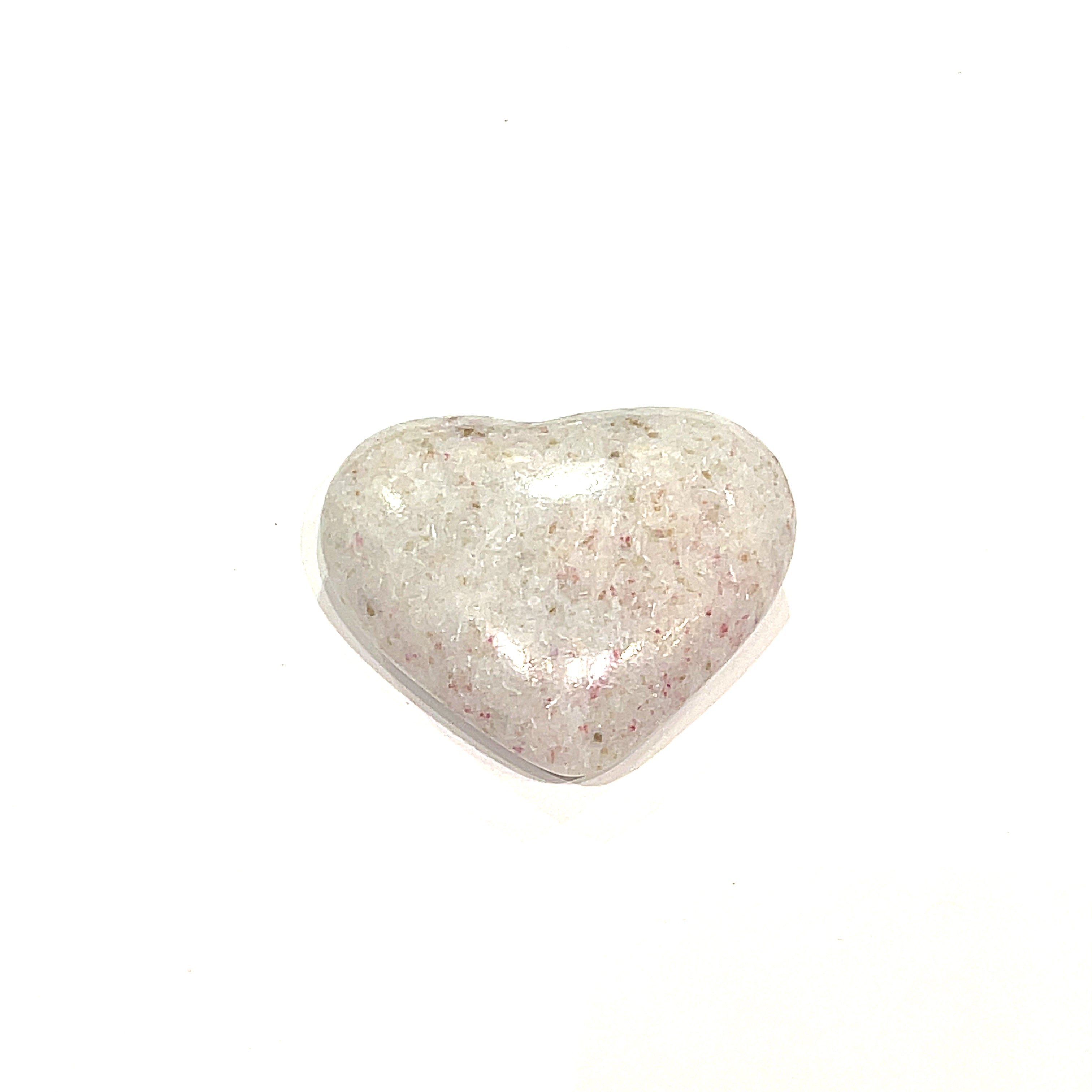 The smallest Cinnabar gemstone heart displayed on a white background front, center, overview. 