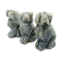 Three Labradorite hound Dogs gemstone carving on white background, front view.