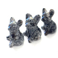 Three Moss Agate Bull Dogs gemstone carving on white background, front view. 