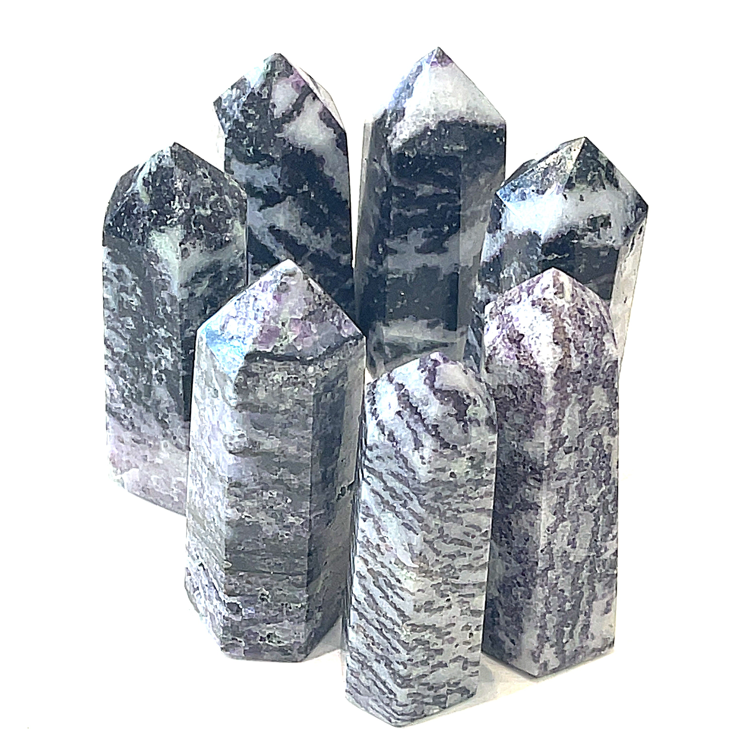  Tiffany gemstone towers displayed against a white background, with varying shades of purple and white patterns, front overview. 