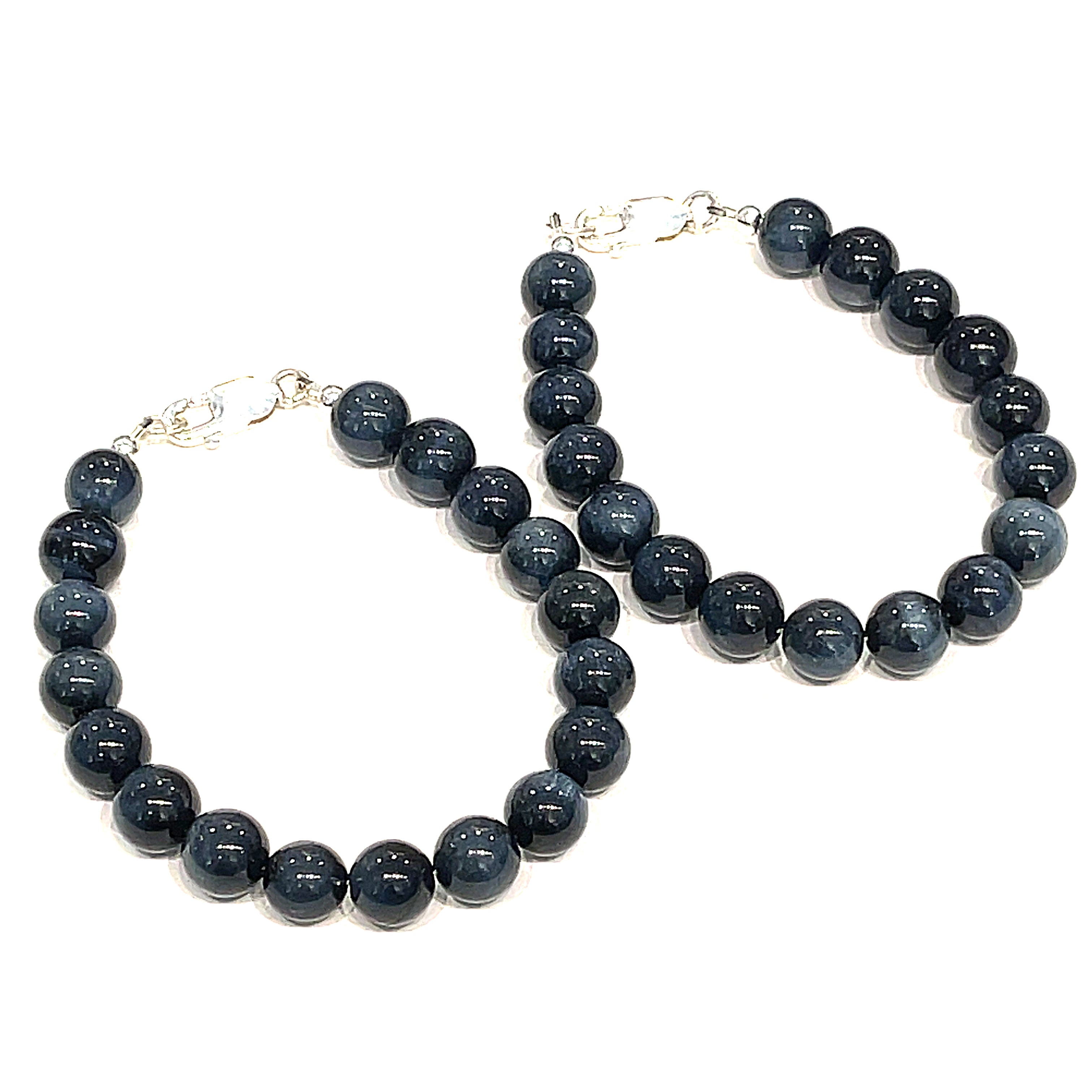 Two 8.5mm Blue Tiger Eye gemstone beaded bracelet with sterling silver lobster claw clasp showing deep midnight blue chatoyant bands on a white background, front view. 
