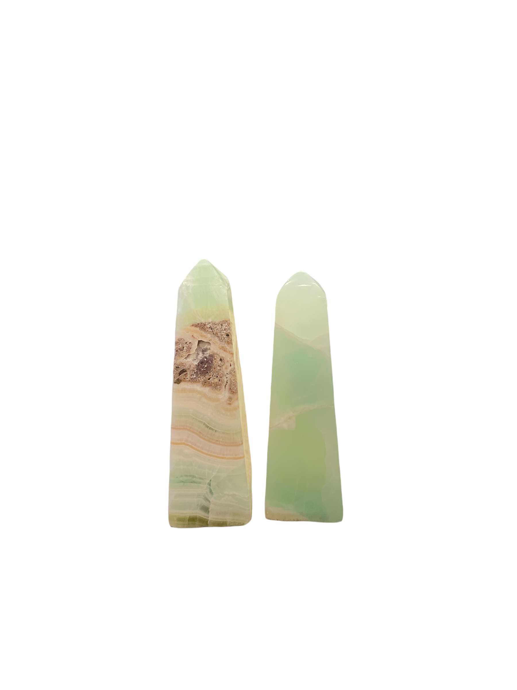 Two green calcite gemstone towers of various sizes arranged in a line on a white background, front overview.