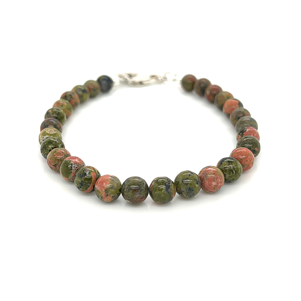 Unakite beaded bracelet with 6mm smooth round gemstones and a sterling silver lobster-claw clasp for gentle emotional healing, on a white background, front view. 