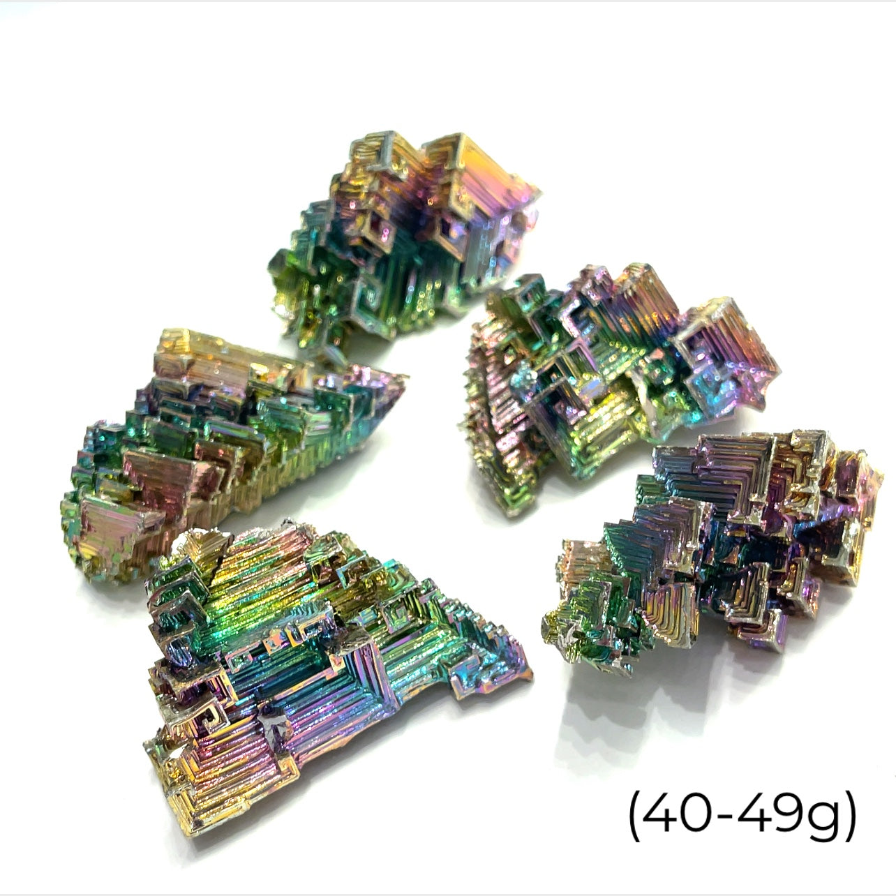 a cluster of  bismuth gemstones  (40-49g) on white background  close up overview